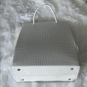 White embossed handbag.